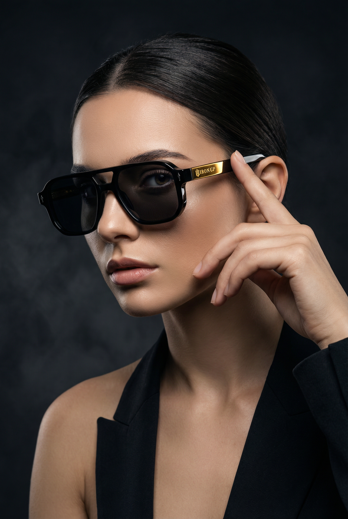 Woman wearing Iron Up Capone sunglasses, studio portrait