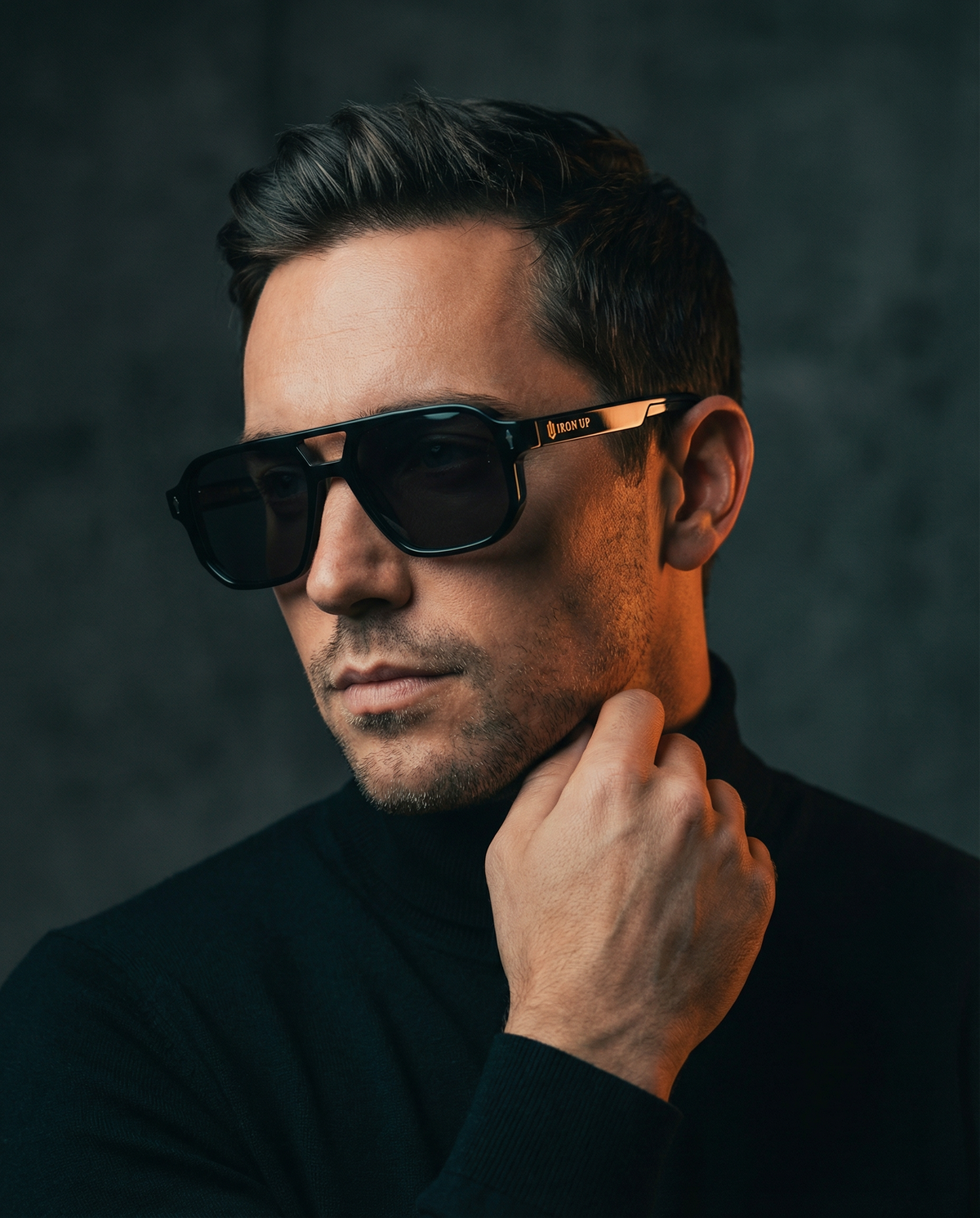 Man wearing Iron Up Capone sunglasses, studio portrait