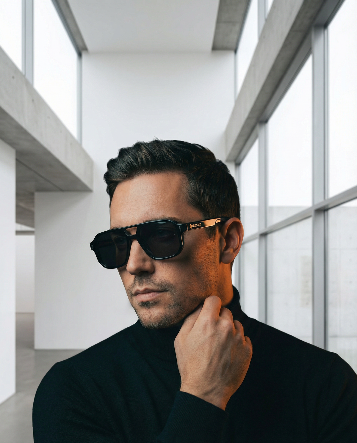 Man wearing Iron Up Capone sunglasses in a modern building